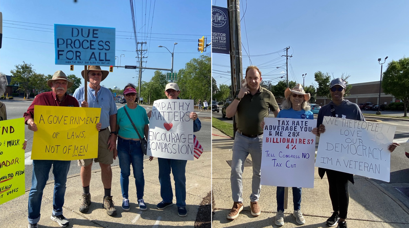 Protesters holding signs